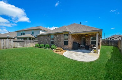 Brick on all four sides, extended patio, covered patio and sprinkler system.