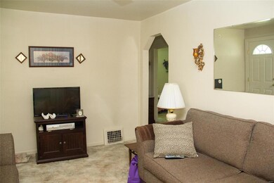 Living room with arch doorway