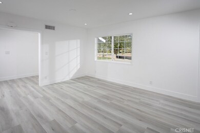 Family Room - Freshly painted, New smooth ceilings, New recessed lights, New light switches and outlets, New base moldings and New wood - grained luxury vinyl tile flooring