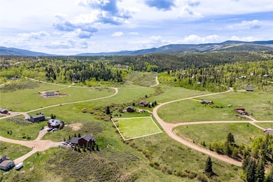 Open space is to the left of the lot looking from