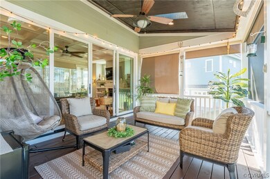 The screened porch is a great place to relax and e