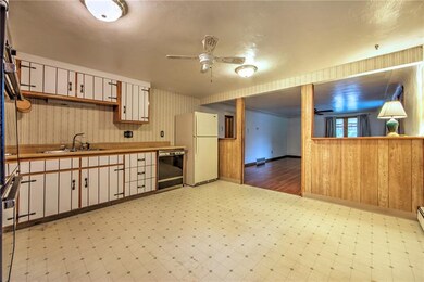 The kitchen is fully equipped with ovens, cook top