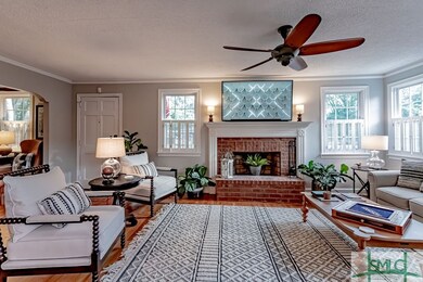 Living room with brick fireplace.