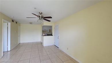 Spare room with ceiling fan, baseboards, visible v