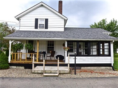 front house side view , large covered deck,