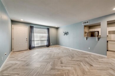 View from dining to living and front entry door an