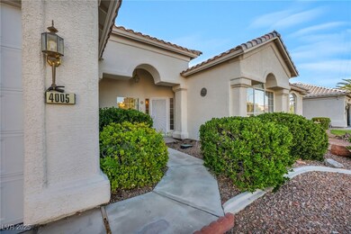 Doorway to property with stucco siding and a tiled