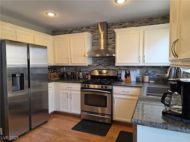 Kitchen with large movable island, stainless steel