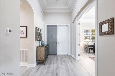 View of Foyer towards front door with light wood-s