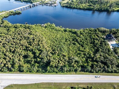 Bird's eye view of a notable bridge and a nearby body of water