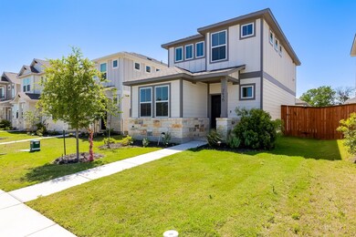 View of front facade featuring fence, a front yar