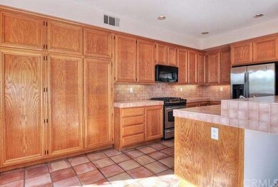 Kitchen offers loads of cabinet space.