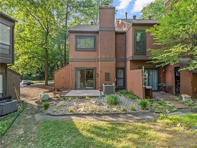 Rear view of home with composite deck overlooking