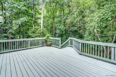 The newly sealed deck overlooks the back yard.