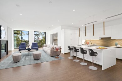 Enter into a vast, airy living area perched among