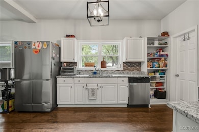Kitchen featuring appliances with stainless steel