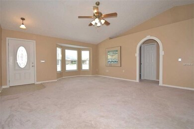 Greatroom with vaulted ceiling & triple windows that let the natural light in!