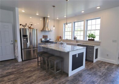 Updated stainless steel appliances compliment the 