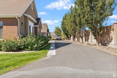 View Of Road to Driveway and Garage