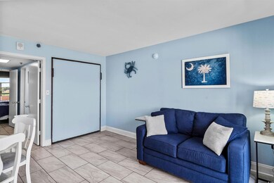 Living room featuring baseboards