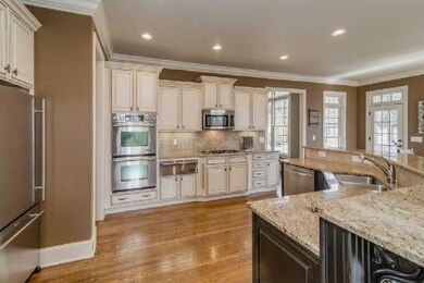 Look at the bead board accents with coffee glaze contracting and coordinating with the granite.  So much space here plus two pantries for the cook to store all the small appliances and food stuffs.