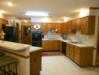 Spacious kitchen with breakfast bar.