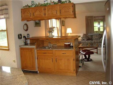 Kitchen CONVENIENTLY LOCATED WETBAR BETWEEN KITCHE
