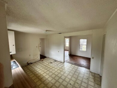 Spare room featuring a textured ceiling and sink