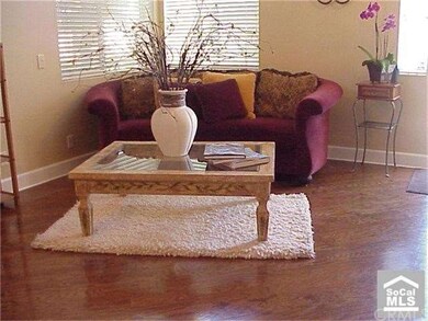 Living Room has Wood Flooring set on angle.