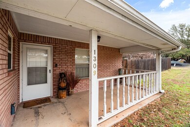 Doorway to property with covered porch
