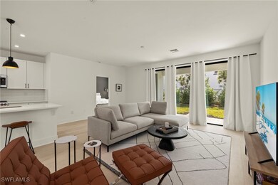 Living room with light hardwood / wood-style floor