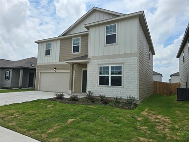 View of front of home featuring board and batten 