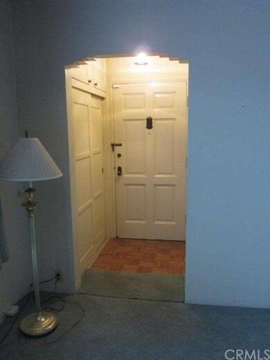 Entry with coat closet and storage area.