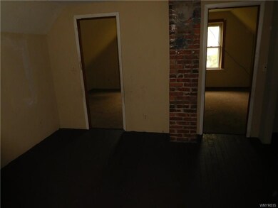 Upper living area with closets off upper bedroom