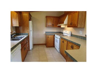 Kitchen. Many oak cabinets with breakfast bar, app