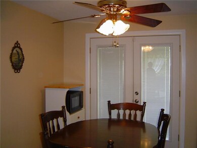 French doors with integral blinds lead to deck.