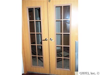 Foyer. These lovely French doors separate the part