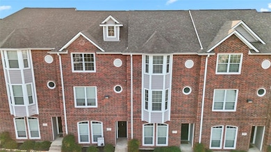 Classic red-brick façade showcasing Unit 203 townhome units included in this investment package.