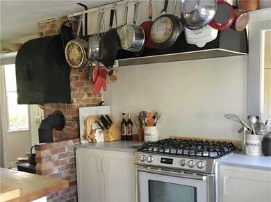Brick hearth with wood stove adds...