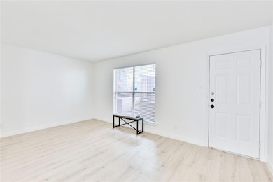 Spare room featuring light wood finished floors a