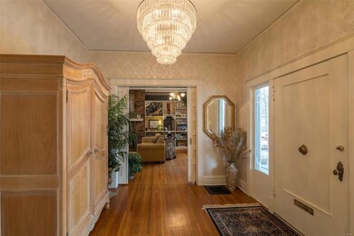Beautiful Foyer with updated and absolutely beautiful chandelier.