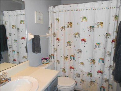 The main bath has a tub and a double linen closet.