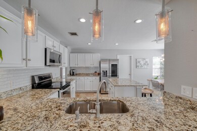 Kitchen with appliances with stainless steel fini