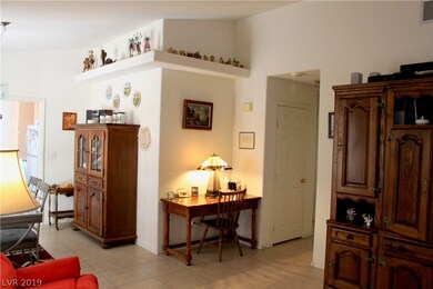 Vaulted ceilings with pot shelving are featured in