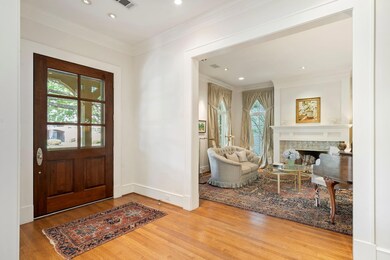 Foyer with ornamental molding, hardwood / wood-sty