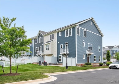 View of property with central air condition unit,