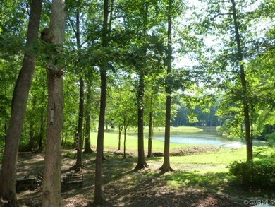 Private rear yard with access to pond.