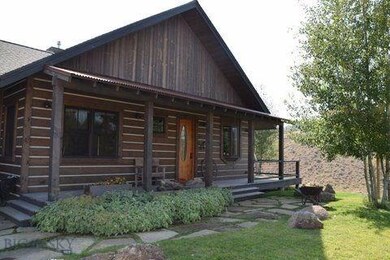 Front porch and front door, facing north with rive