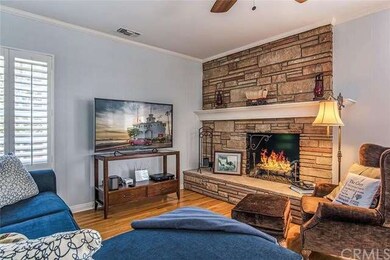 Open living room with gleaming hardwood floors and
