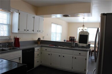 Bright, clean kitchen with new flooring. Cook on s